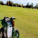 Panoramic view of a lush green golf course at Chena Bend Golf Course. Smooth
