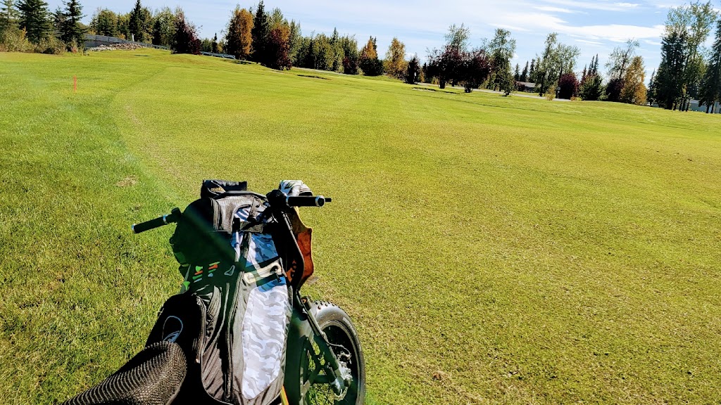 Panoramic view of a lush green golf course at Chena Bend Golf Course. Smooth