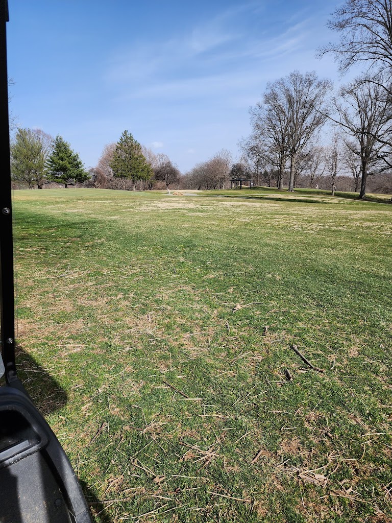 Panoramic view of a lush green golf course at Cherokee Golf Course. Smooth