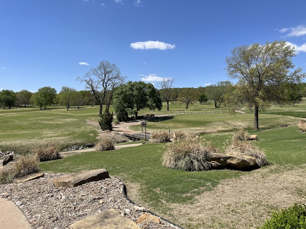Panoramic view of a lush green golf course at Cherokee Hills Golf Club. Smooth