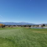 Panoramic view of a lush green golf course at Cherokee Ridge Golf Course. Smooth