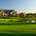 Panoramic view of a lush green golf course at Cherry Creek Country Club. Smooth