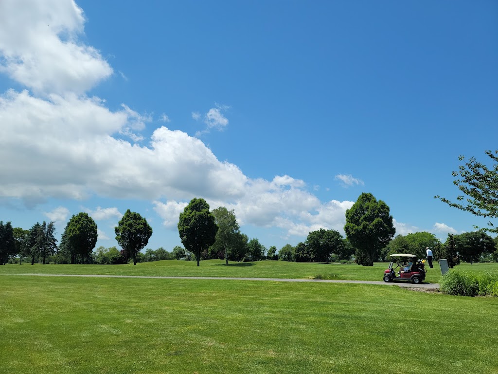 Panoramic view of a lush green golf course at Cherry Creek Golf Links. Smooth