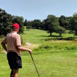 green grass with the flag in the hole.