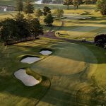 Panoramic view of a lush green golf course at Chesapeake Bay Golf Club. Smooth
