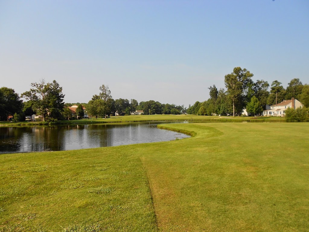Panoramic view of a lush green golf course at Chesapeake Golf Club. Smooth