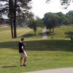 green grass with the flag in the hole.