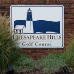 Panoramic view of a lush green golf course at Chesapeake Hills Golf Course. Smooth