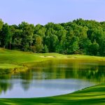 Panoramic view of a lush green golf course at Chestatee Golf Club. Smooth