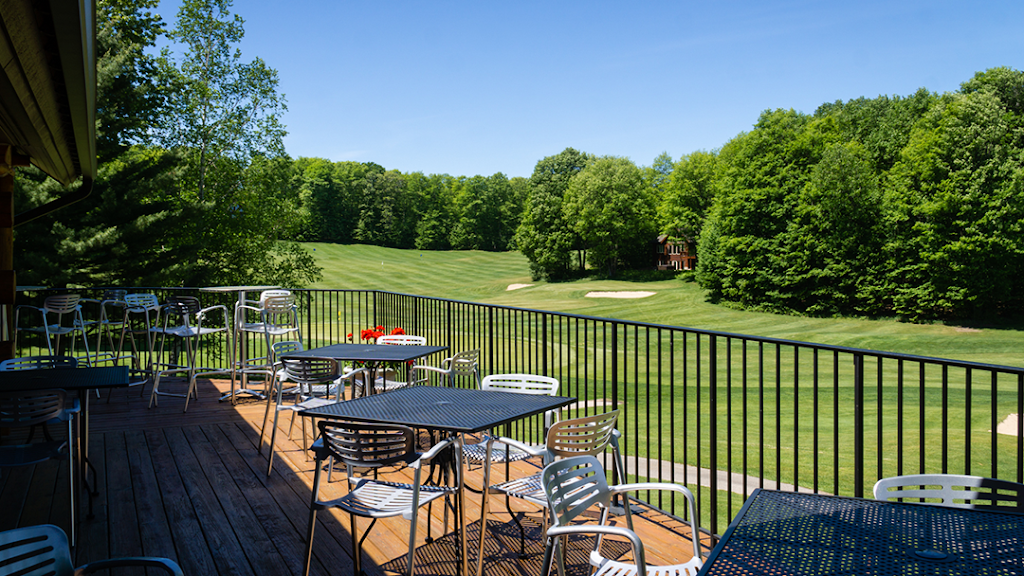 Panoramic view of a lush green golf course at Chestnut Valley Golf Course. Smooth