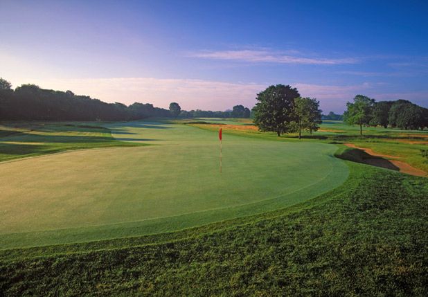Panoramic view of a lush green golf course at Chicago Golf Club. Smooth