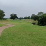 Panoramic view of a lush green golf course at Chickasaw Pointe Golf Club. Smooth