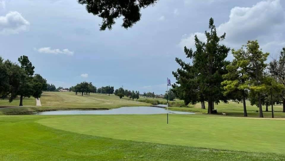 Panoramic view of a lush green golf course at Chickasha Golf and Country Club. Smooth