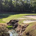 Panoramic view of a lush green golf course at Chicopee Woods Golf Course. Smooth