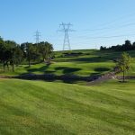 Panoramic view of a lush green golf course at Chippewa Golf Club. Smooth