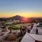 Panoramic view of a lush green golf course at Chiricahua Golf Course. Smooth