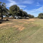 Panoramic view of a lush green golf course at Choctaw Creek Golf Course. Smooth