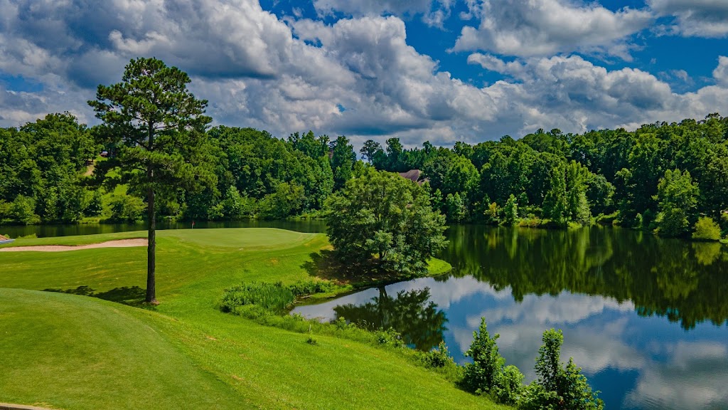 Panoramic view of a lush green golf course at Cider Ridge Golf Club. Smooth