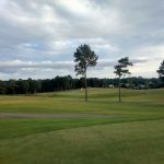 Panoramic view of a lush green golf course at City of Bessemer Frank House Golf Course. Smooth