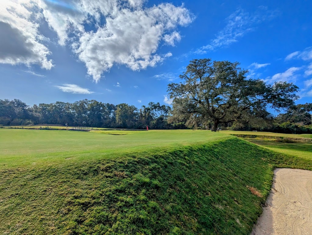 Panoramic view of a lush green golf course at City of Charleston Municipal Golf Course. Smooth