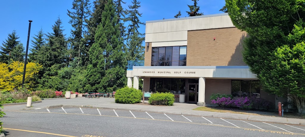 Panoramic view of a lush green golf course at City of Lynnwood Municipal Golf Course. Smooth