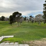 Panoramic view of a lush green golf course at City of North Las Vegas Municipal Par 3 and Disc Golf Club. Smooth