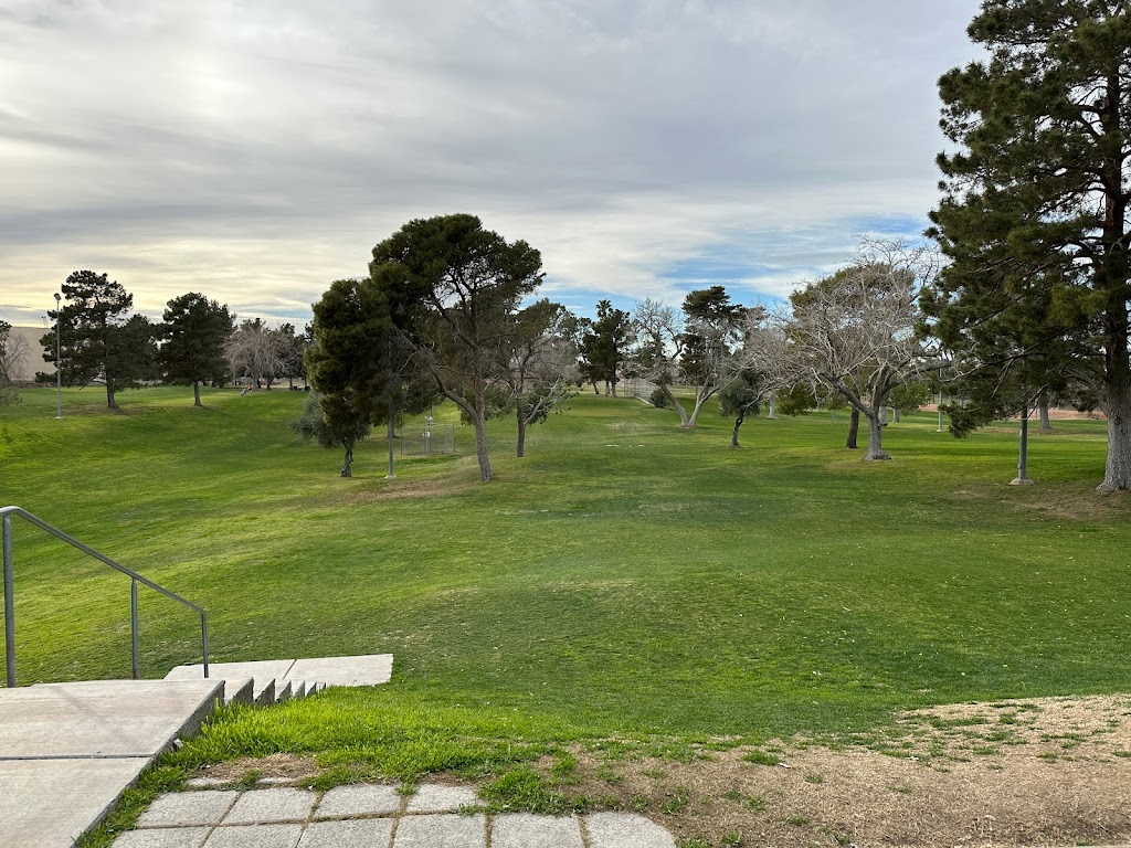 Panoramic view of a lush green golf course at City of North Las Vegas Municipal Par 3 and Disc Golf Club. Smooth