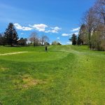 Panoramic view of a lush green golf course at City of South Portland: Municipal Golf Course. Smooth