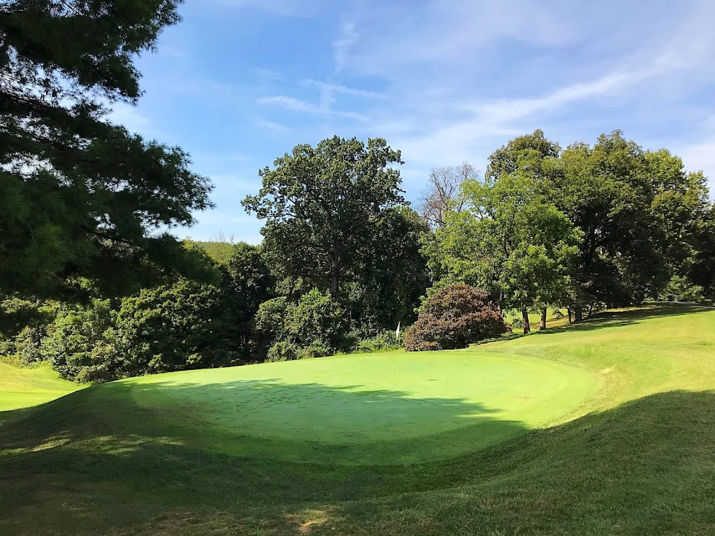 Panoramic view of a lush green golf course at Clarksburg Country Club. Smooth