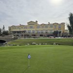 green grass with the flag in the hole.