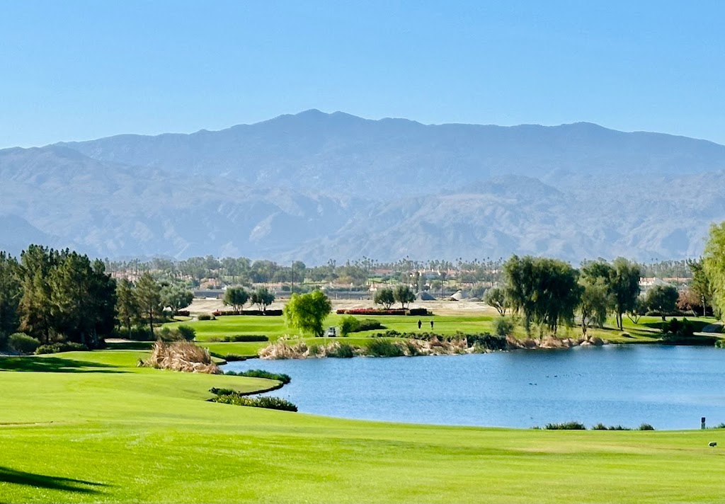 Panoramic view of a lush green golf course at Classic Club. Smooth