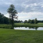 Panoramic view of a lush green golf course at Clinton Golf Course. Smooth