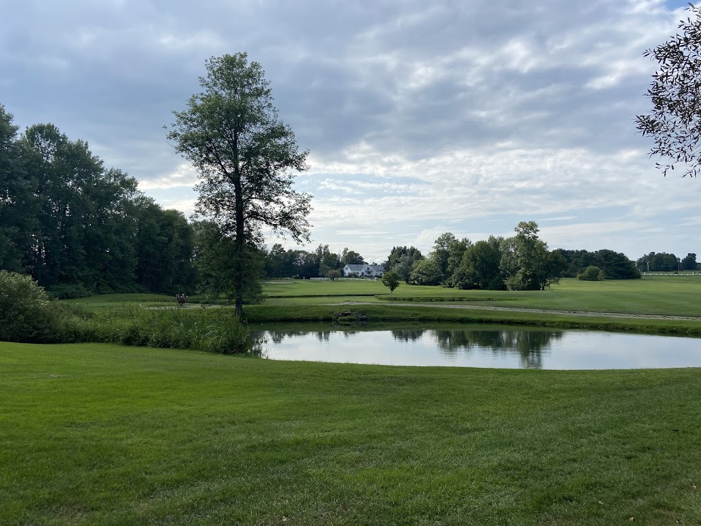 Panoramic view of a lush green golf course at Clinton Golf Course. Smooth