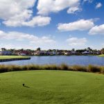 Panoramic view of a lush green golf course at Club Renaissance. Smooth