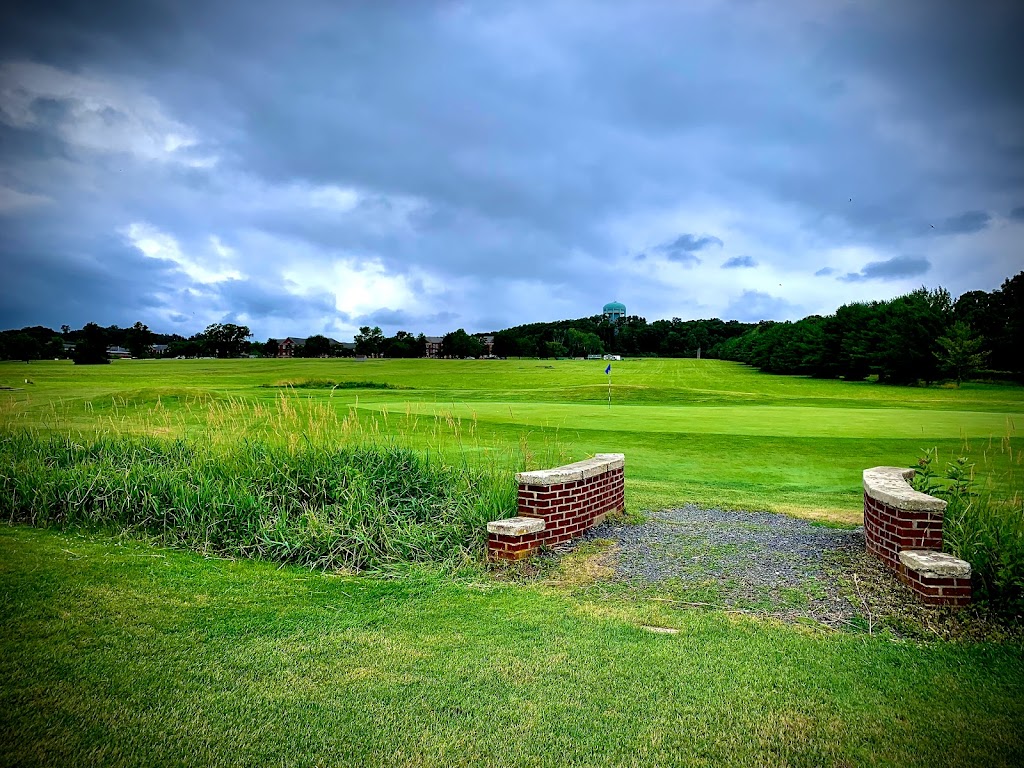 Panoramic view of a lush green golf course at Coakley-Russo Memorial Golf Course. Smooth
