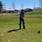 green grass with the flag in the hole.