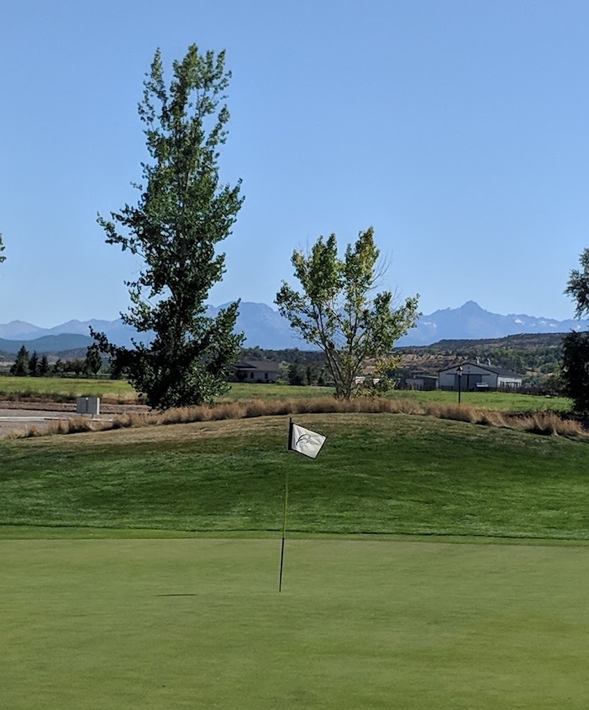 Panoramic view of a lush green golf course at Cobble Creek Golf Club. Smooth