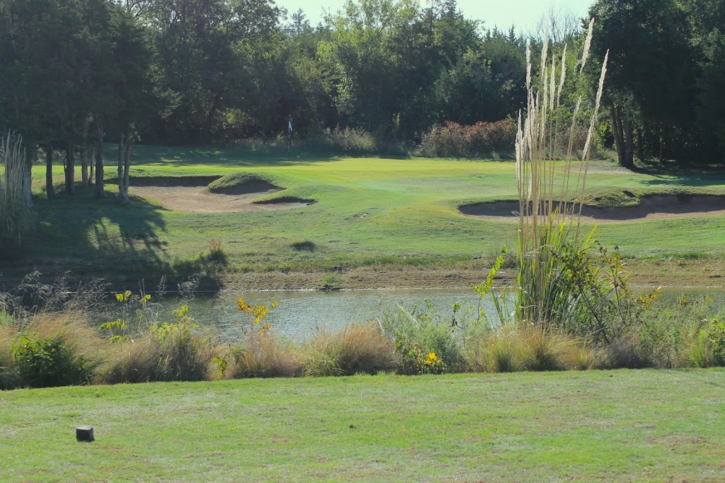 Panoramic view of a lush green golf course at Cobblestone Creek Golf Course. Smooth