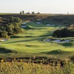 green grass with the flag in the hole.