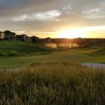 Panoramic view of a lush green golf course at Colbert Hills Golf Course. Smooth