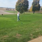 green grass with the flag in the hole.