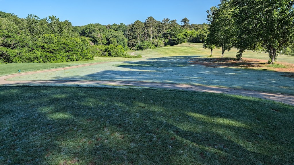 Panoramic view of a lush green golf course at College Park Golf Course. Smooth