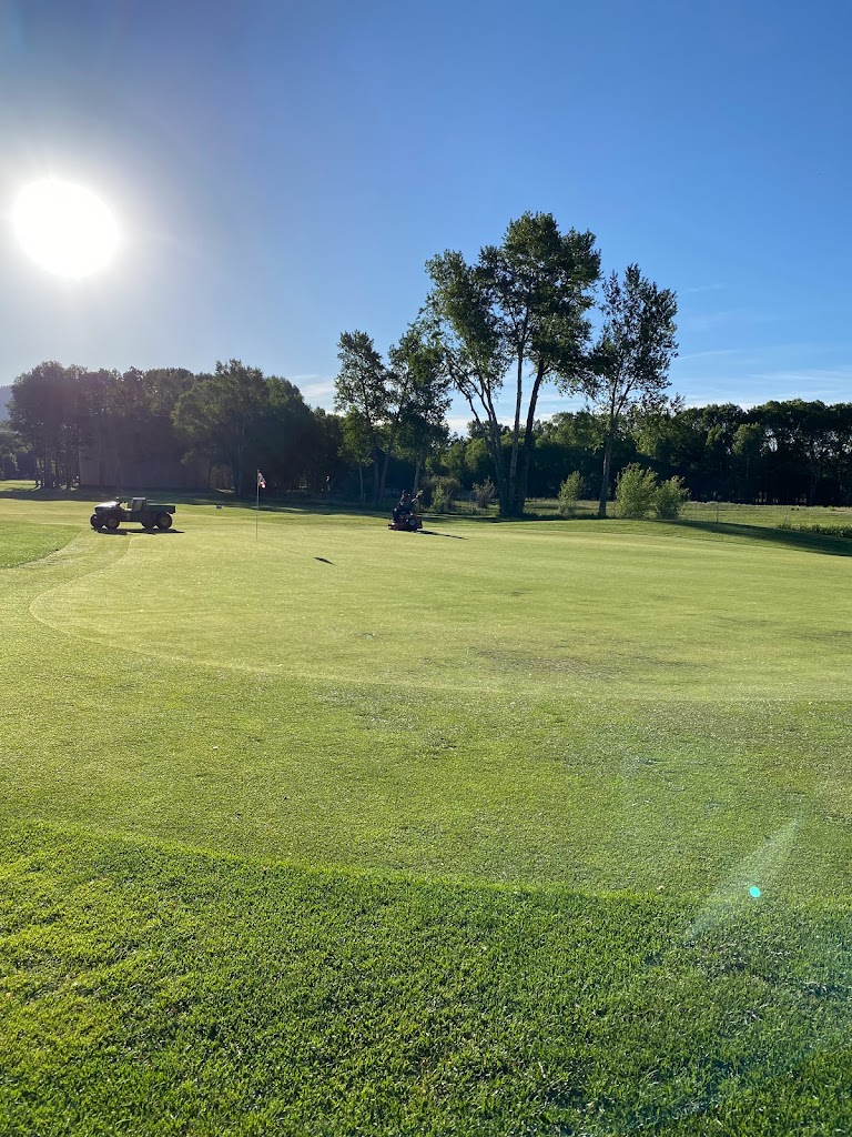 Panoramic view of a lush green golf course at Collegiate Peaks Golf Course. Smooth