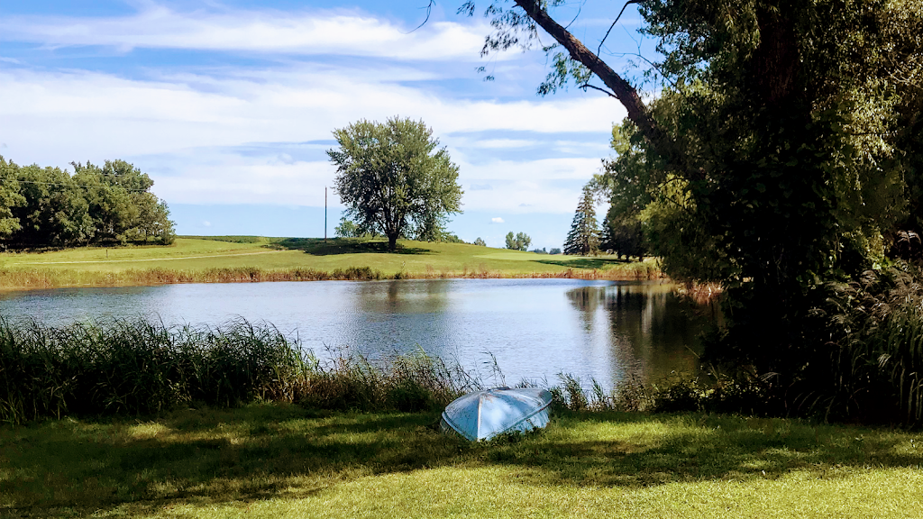 Panoramic view of a lush green golf course at Collison Par 3 Golf Course. Smooth