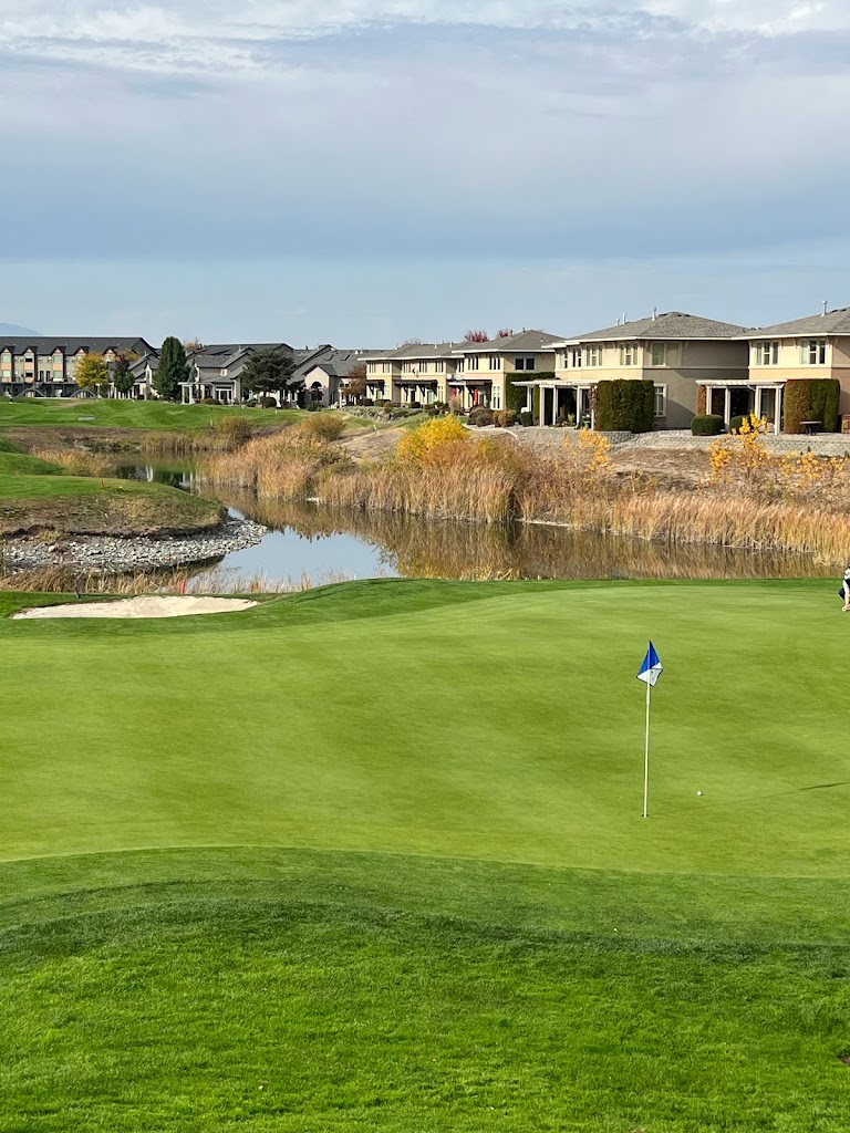 Panoramic view of a lush green golf course at Columbia Point Golf Course. Smooth
