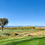 Panoramic view of a lush green golf course at CommonGround Golf Course. Smooth