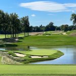 Panoramic view of a lush green golf course at Congressional Country Club. Smooth