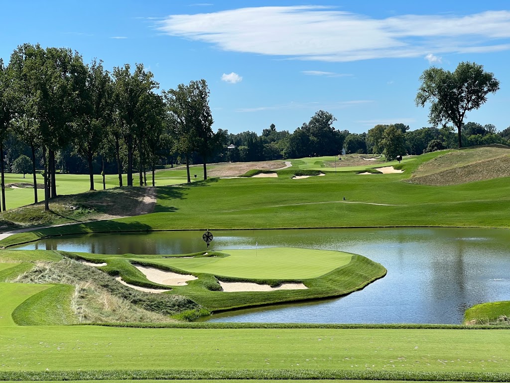 Panoramic view of a lush green golf course at Congressional Country Club. Smooth