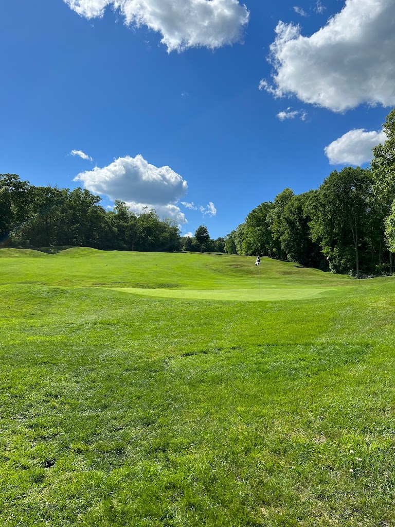 Panoramic view of a lush green golf course at Connecticut National Golf Club. Smooth