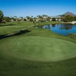 Panoramic view of a lush green golf course at Continental Golf Club. Smooth